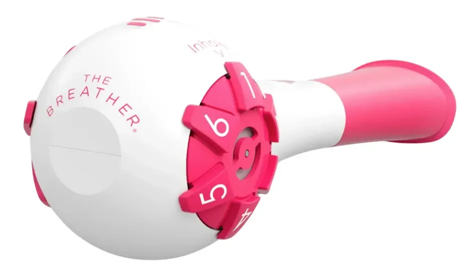 The Breather, a white and pink respiratory training device with a numbered dial