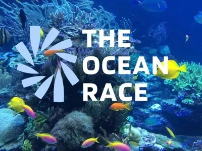 Le logo The Ocean Race sur un fond de coraux et de poissons colorés.