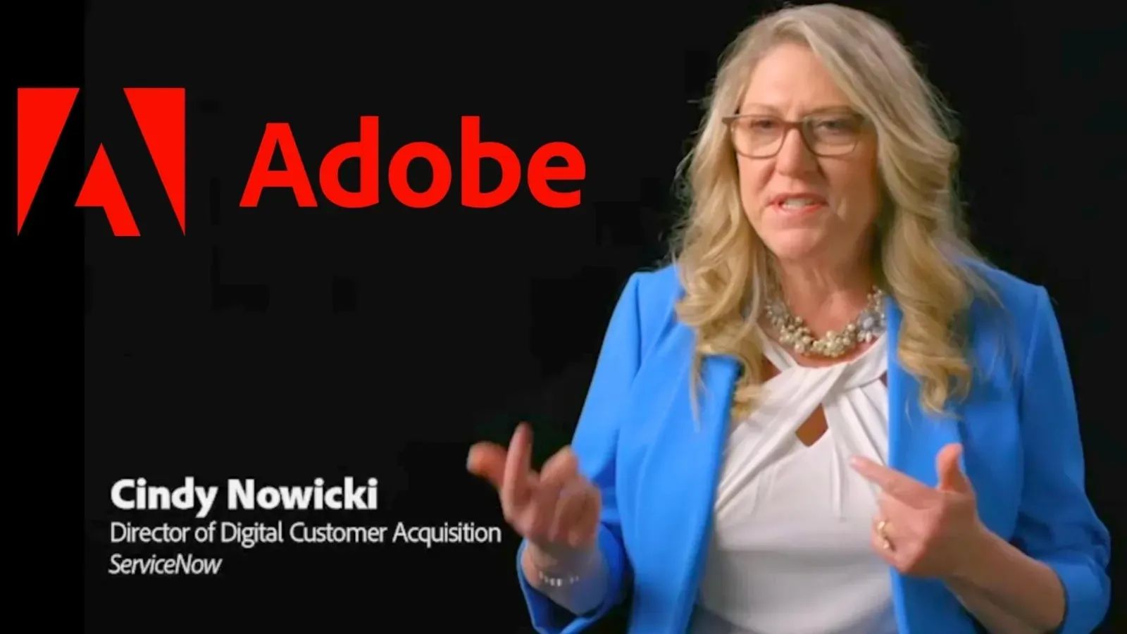 Cindy Nowicki from ServiceNow speaking to camera beside the Adobe logo